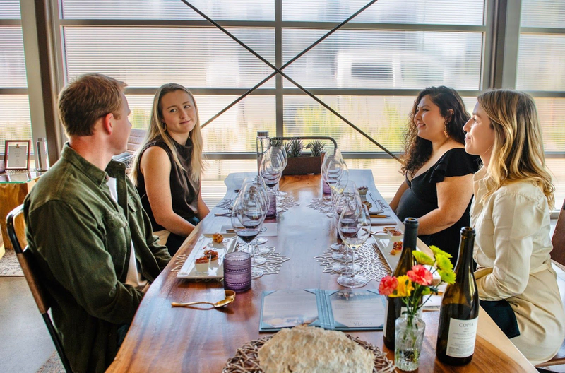 Wine tasting group at Copia Vineyards indoor table