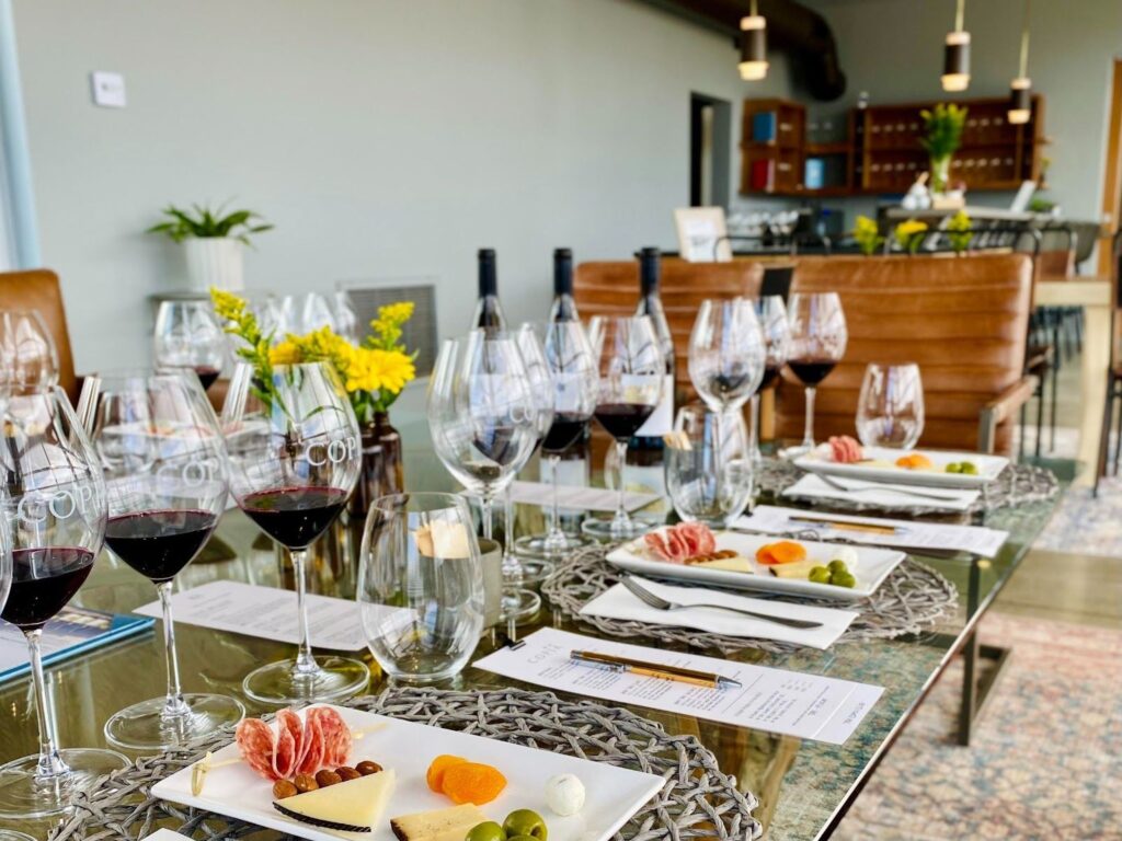 table set for wine tastings with cheese samplings