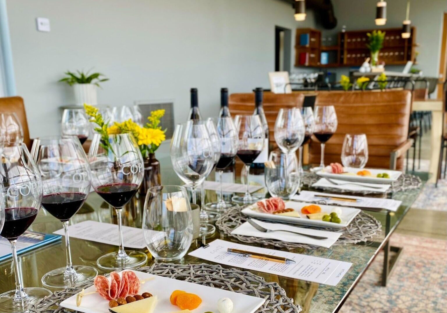 table set for wine tastings with cheese samplings